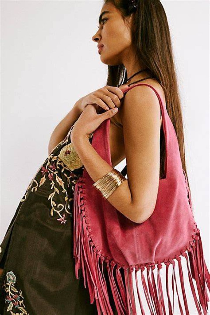Fringe: The unique outfit featured a fringe cape in the back as well as a wide belt